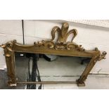 A Victorian carved giltwood and gesso framed over mantel mirror with Prince of Wales feather