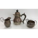 A George V silver three-piece tea set in the 18th Century taste, of pear form, comprising teapot,