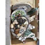 Two boxes of sundry decorative items to include a large collection of decorative stone eggs