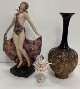 A Royal Dux figure of a 1930s dancer with flared multi-coloured skirt, impressed No.