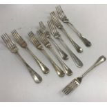 A set of three Alfenide white metal table forks,