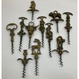 A collection of eleven brass handled novelty corkscrews including Dartmoor pixie, Devon pixie,