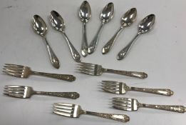 A set of six sterling silver cast dessert forks and a set of six sterling silver teaspoons,11.