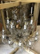 A vintage glass eighteen branch electrolier in the Venetian taste with glass drops,