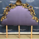 A 19th Century French carved giltwood framed bedhead in the Rococo taste with shell finial within C