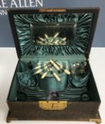 A 19th Century leather covered and lacquered brass embellished vanity case 29.