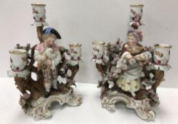 A pair of 19th Century Schierholz figural candle holders, she amongst blossom,