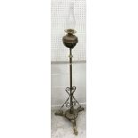 A Victorian brass telescopic oil lamp standard on tripod base 156 cm high including glass chimney