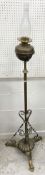 A Victorian brass telescopic oil lamp standard on tripod base 156 cm high including glass chimney