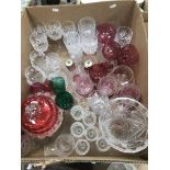 A collection of glassware to include a cranberry lidded dish,