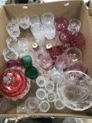 A collection of glassware to include a cranberry lidded dish,
