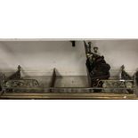 A brass fire kerb in the Rococo style with shell and scrolling acanthus decoration,