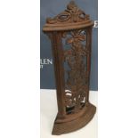 An unusual cast iron corner stick stand in the Aesthetic taste with floral spray pierced decoration,