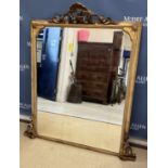 A Victorian giltwood and gesso framed over mantel mirror with shell and foliate carved surmount