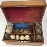 A 19th Century mahogany Apothecary box containing various glass bottles, scales,