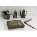 A collection of small silver wares and objets de vertus including a miniature Continental embossed