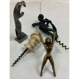 A collection of four novelty corkscrews including a white composition moulded head of Edward VIII