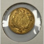 A United States gold $1 coin, 1853,