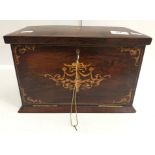 An Edwardian rosewood and inlaid desk top stationery cupboard,