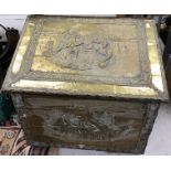 A large embossed brass covered slope top coal box,