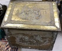A large embossed brass covered slope top coal box,