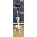 A Victorian wrought iron white painted telescopic lamp standard with copper oil lamp reservoir