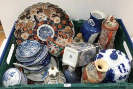 A crate of assorted Chinese and Japanese china wares of various age,