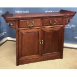 A modern Chinese cherry wood side cabinet,