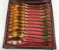A set of twelve 19th Century Continental silver gilt “Fiddle and Thread” pattern grapefruit spoons,