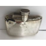 A George V silver hip flask of slightly curved form inscribed "E.H." (by William Neale & Son Ltd.