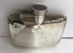 A George V silver hip flask of slightly curved form inscribed "E.H." (by William Neale & Son Ltd.