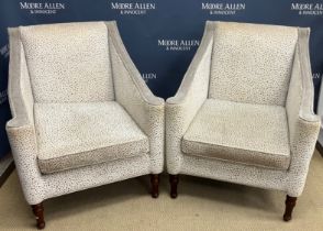 A set of four modern cream and taupe upholstered armchairs on turned front legs,