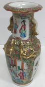 A 19th Century Chinese famille rose and giltwork embellished vase with flared rim and lion and ball