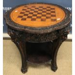 A 20th Century lacquered games table in the 19th Century manner,