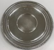 An American sterling silver dish with gadrooned and pierced rim,
