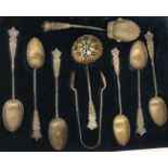 A cased set of six George V silver tea spoons, sugar tongs,