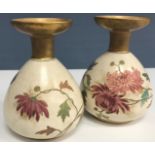 A pair of Royal Doulton Art ware floral decorated vases together with a matching larger example,