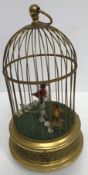 A 20th Century West German brass cased "singing bird" in bird cage automaton music box with pierced