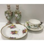 A Victorian Worcester relief work rose decorated cup and saucer bearing crown and sceptre impressed