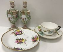 A Victorian Worcester relief work rose decorated cup and saucer bearing crown and sceptre impressed