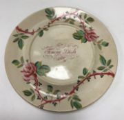 A 19th Century transfer and hand-decorated rose pattern "tongue" dish,