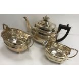 A George III silver shaped rectangular tea set with central reeded banded decoration,