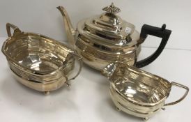 A George III silver shaped rectangular tea set with central reeded banded decoration,