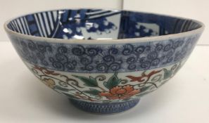 A 20th Century Chinese blue and white bowl decorated with variation of '100 boys' pattern to the
