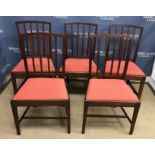 A set of five 19th Century mahogany framed dining chairs with spindle backs over drop in seats on