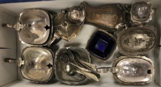 A collection of various cruets including lidded mustards, open salt, peppers, various salt spoons,