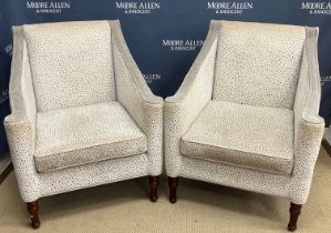A set of four modern cream and taupe upholstered armchairs on turned front legs,
