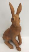 A Suzie Marsh coloured bisque pottery figure of a seated hare, limited edition No.