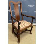 An 18th Century walnut open arm chair,
