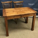 A modern pine farmhouse style kitchen table,